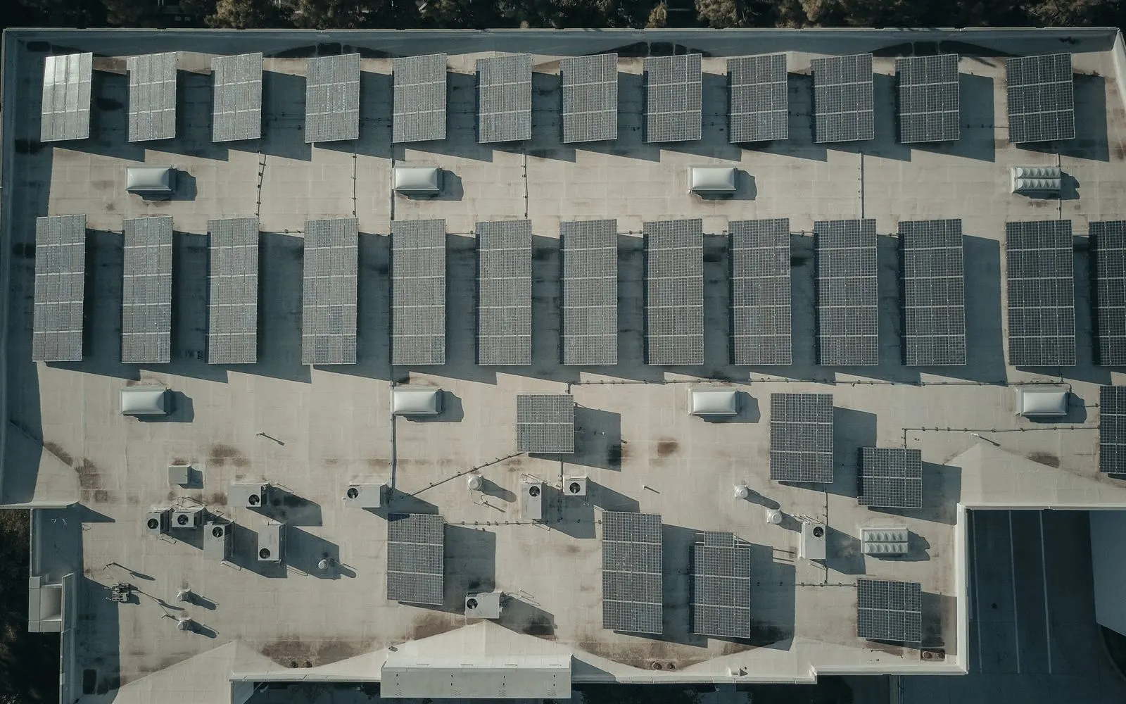 Pexels: Solar panels on a building roof by Kindel Media
